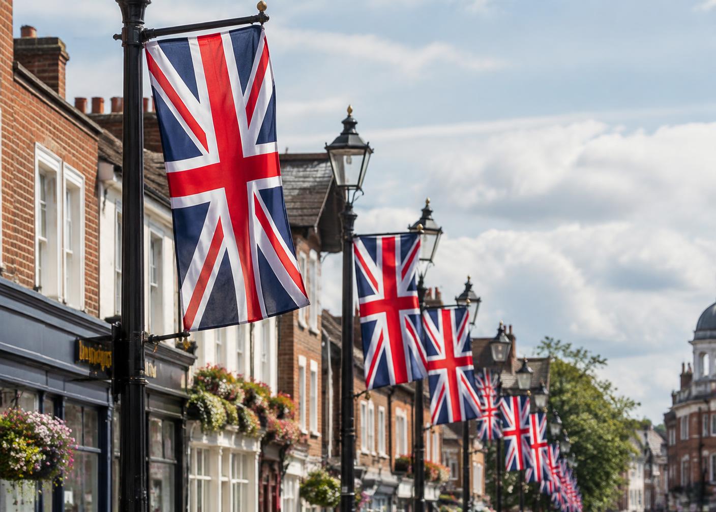Union Jack flags displayed along a British street